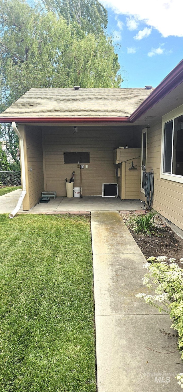 5720 N Oasis, Garden City, ID 83714 - property entrance with a yard and roof with shingles