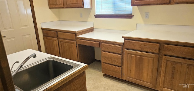 5720 N Oasis, Garden City, ID 83714 - kitchen with a sink, brown cabinetry, light countertops, and an office area