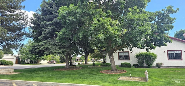 5720 N Oasis, Garden City, ID 83714 - view of front of home with a front lawn and stucco siding