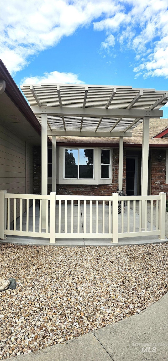 5720 N Oasis, Garden City, ID 83714 - view of home's exterior with a pergola and brick siding