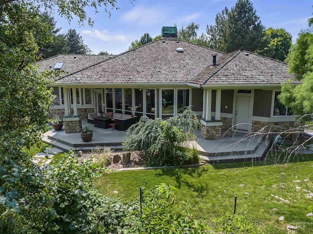 rear view of house featuring an outdoor living space, a lawn, and a deck