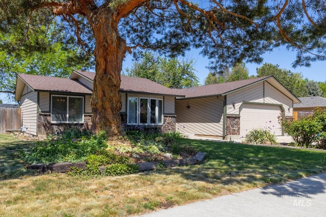 3929 N Shamrock Ave, Boise, ID 83713 - view of front facade with stone siding, a garage, a front yard, and roof with shingles