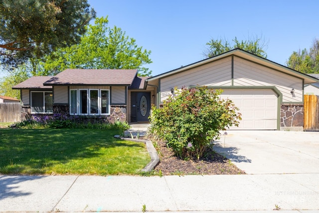 3929 N Shamrock Ave, Boise, ID 83713 - ranch-style home with stone siding, an attached garage, and concrete driveway