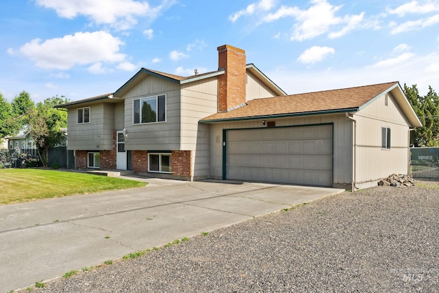 2045 11th Ave, Clarkston, WA 99403 - view of front facade featuring a garage, concrete driveway, and a chimney
