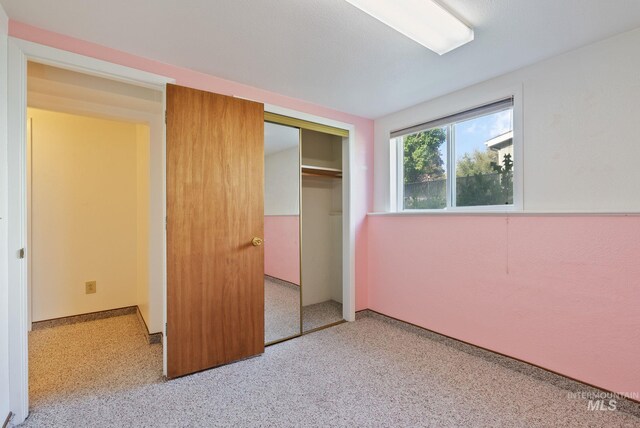 2045 11th Ave, Clarkston, WA 99403 - unfurnished bedroom featuring a closet and carpet flooring