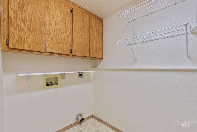 2045 11th Ave, Clarkston, WA 99403 - washroom with cabinet space, hookup for an electric dryer, washer hookup, and baseboards