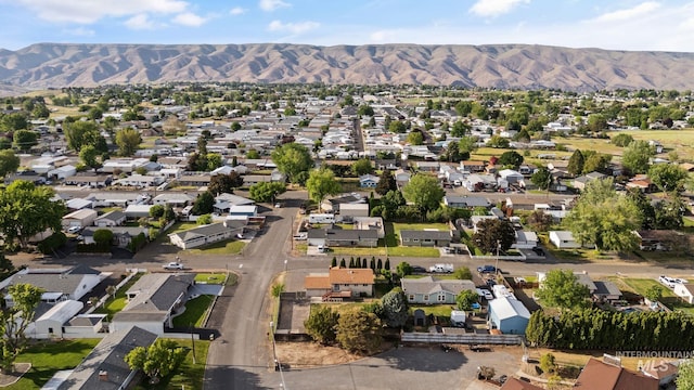 2045 11th Ave, Clarkston, WA 99403 - aerial overview of property's location with a mountainous background and nearby suburban area