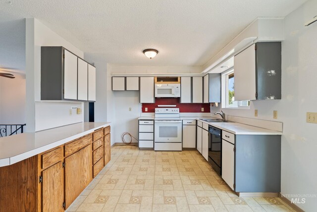 2045 11th Ave, Clarkston, WA 99403 - kitchen featuring white appliances, a sink, light countertops, light floors, and a textured ceiling