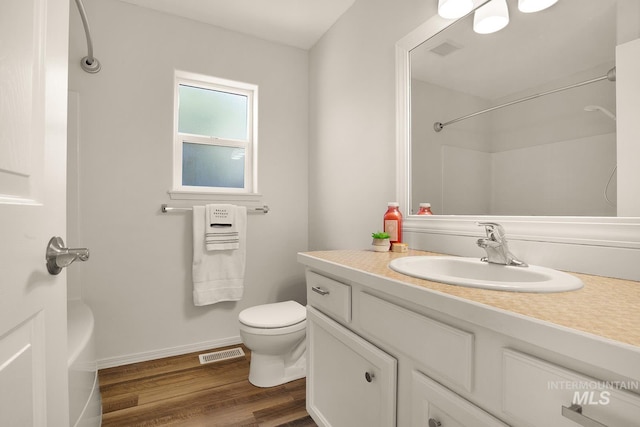 1522 Dana St, Twin Falls, ID 83301 - full bathroom with wood finished floors, vanity, and a shower