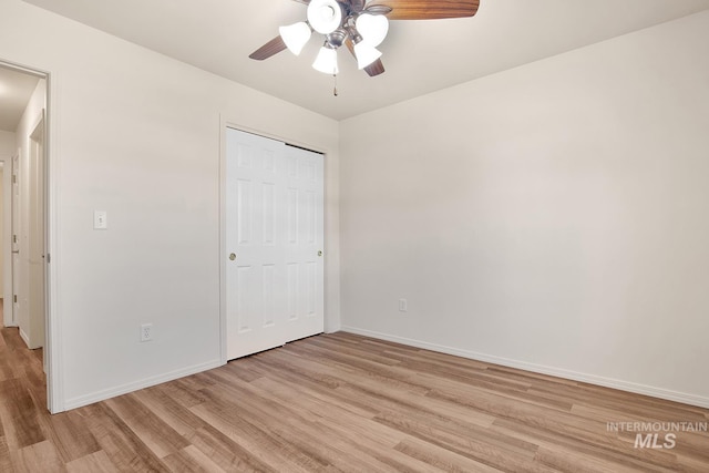 1522 Dana St, Twin Falls, ID 83301 - unfurnished bedroom with light wood finished floors, a closet, and a ceiling fan