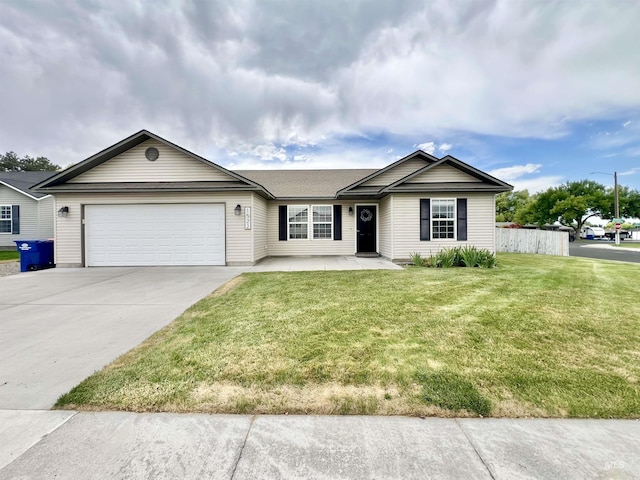 1522 Dana St, Twin Falls, ID 83301 - single story home with an attached garage, driveway, and a front lawn