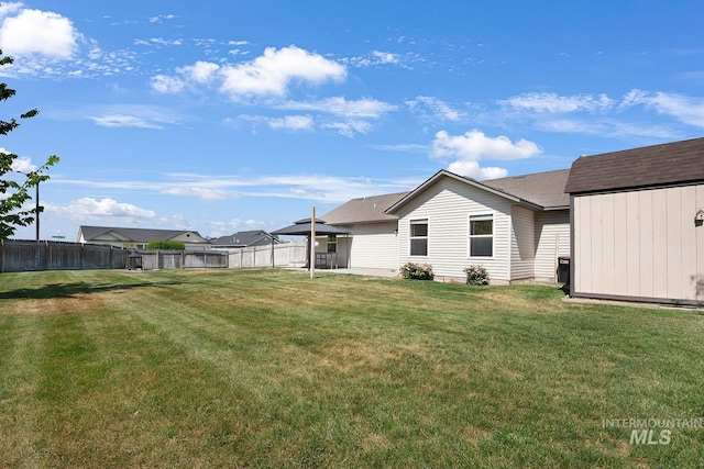 1522 Dana St, Twin Falls, ID 83301 - fenced backyard featuring an outdoor structure