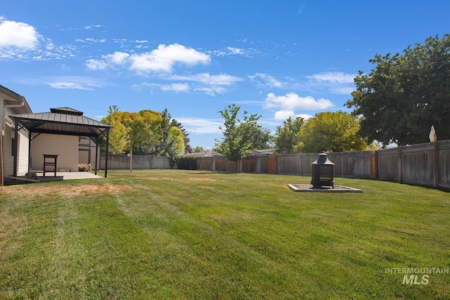1522 Dana St, Twin Falls, ID 83301 - fenced backyard with a gazebo and a patio area