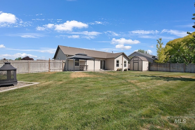 1522 Dana St, Twin Falls, ID 83301 - rear view of house featuring a gazebo, a shed, a fenced backyard, and a patio