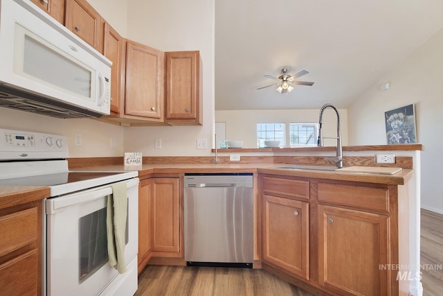 1522 Dana St, Twin Falls, ID 83301 - kitchen featuring white appliances, a peninsula, light wood finished floors, ceiling fan, and light countertops