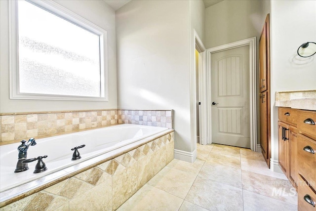 bathroom featuring vanity, tiled bath, and tile patterned floors