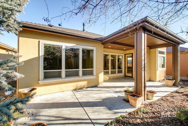 rear view of property with a patio area