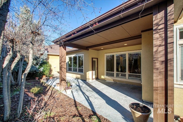 rear view of property featuring a patio