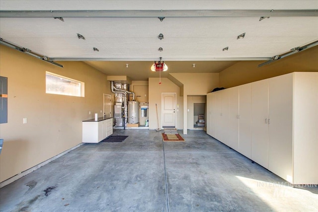 garage with gas water heater and electric panel