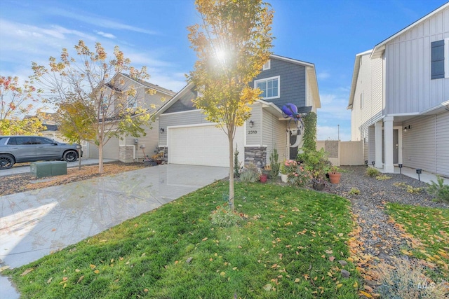 view of front of house with a front yard and a garage