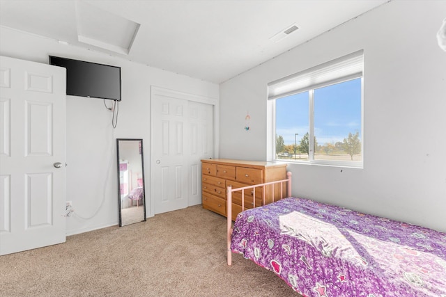 bedroom featuring a closet and carpet flooring