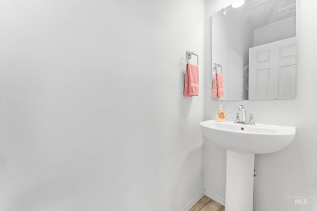 2318 Oxon St, Caldwell, ID 83605 - bathroom featuring baseboards and wood finished floors