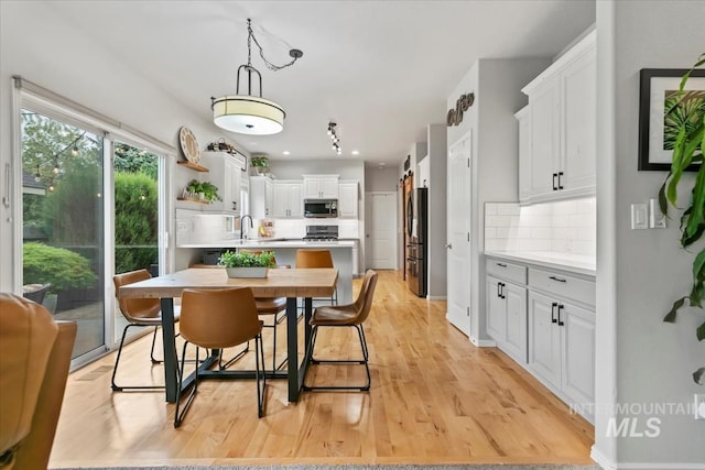 10450 W Antietam St, Boise, ID 83709 - dining room with light wood-style flooring