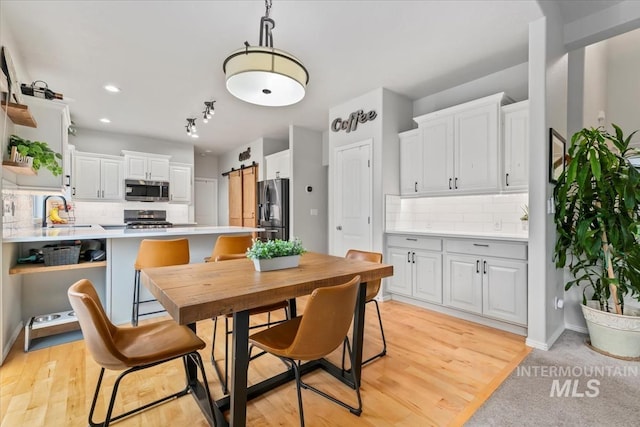 10450 W Antietam St, Boise, ID 83709 - dining room featuring light wood finished floors and recessed lighting