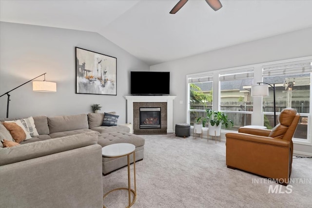 10450 W Antietam St, Boise, ID 83709 - carpeted living room featuring ceiling fan, vaulted ceiling, and a tiled fireplace
