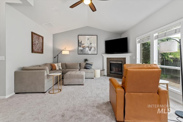 10450 W Antietam St, Boise, ID 83709 - living area with visible vents, a glass covered fireplace, carpet flooring, a ceiling fan, and vaulted ceiling
