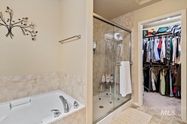 10450 W Antietam St, Boise, ID 83709 - full bathroom with a garden tub, a stall shower, and a spacious closet