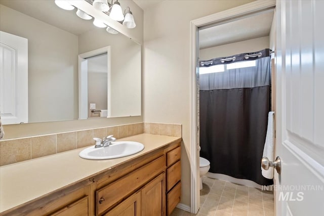 10450 W Antietam St, Boise, ID 83709 - full bathroom with vanity, toilet, and a shower with shower curtain