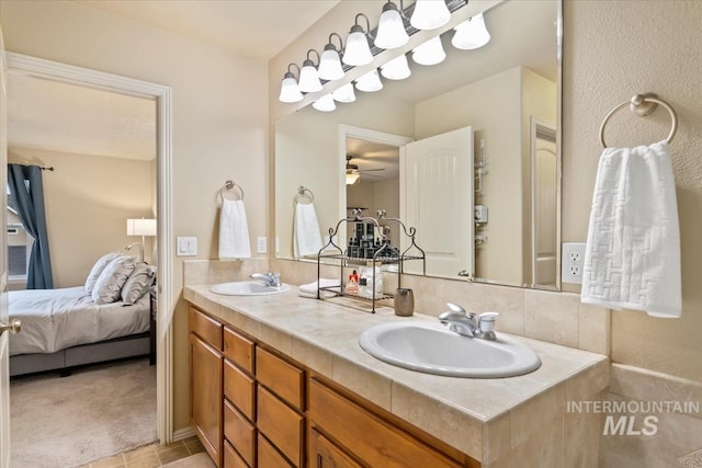 10450 W Antietam St, Boise, ID 83709 - ensuite bathroom with double vanity, a sink, connected bathroom, and a ceiling fan