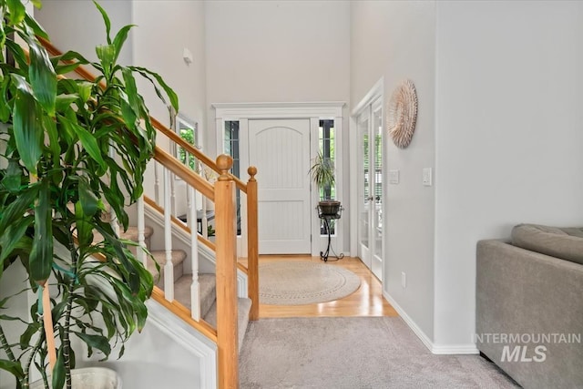 10450 W Antietam St, Boise, ID 83709 - entrance foyer with baseboards, a high ceiling, carpet, and stairs