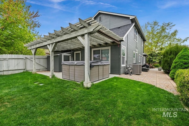10450 W Antietam St, Boise, ID 83709 - back of property featuring fence private yard, central AC, a pergola, a patio, and a hot tub