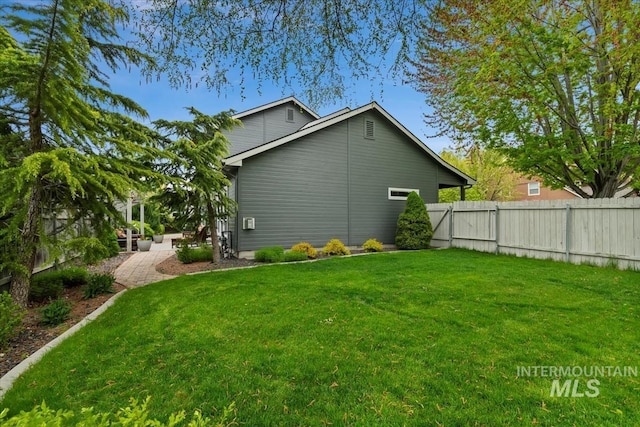 10450 W Antietam St, Boise, ID 83709 - view of side of property featuring a yard and fence