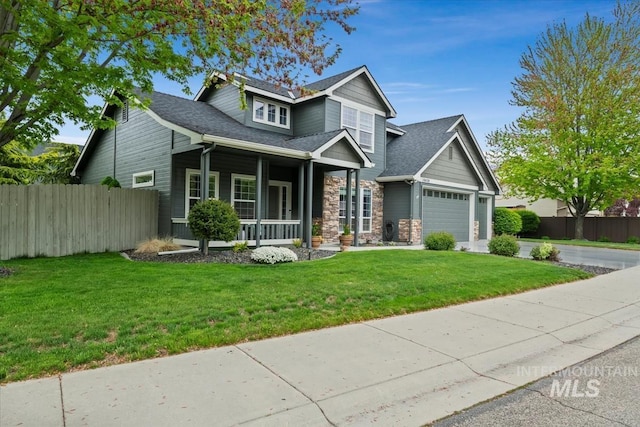 10450 W Antietam St, Boise, ID 83709 - craftsman house with a porch, an attached garage, fence, and a front yard