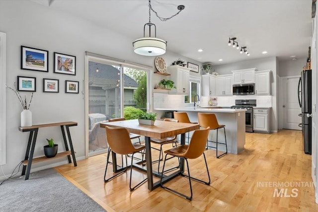 10450 W Antietam St, Boise, ID 83709 - dining room with recessed lighting and light wood-type flooring