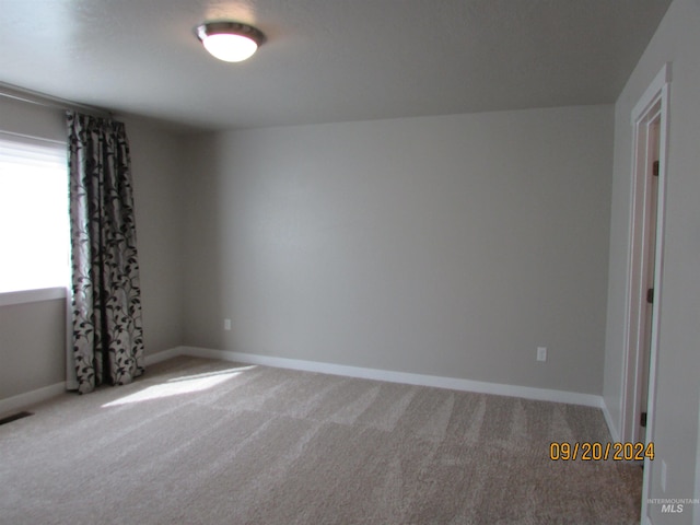 view of carpeted spare room