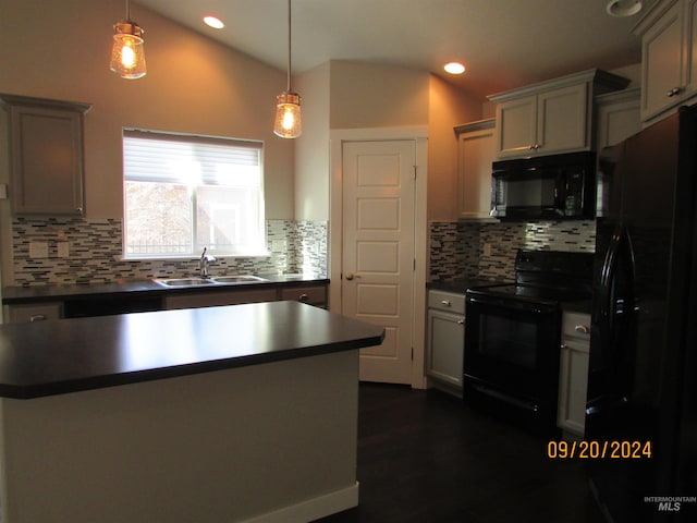 kitchen featuring backsplash, sink, black appliances, vaulted ceiling, and pendant lighting