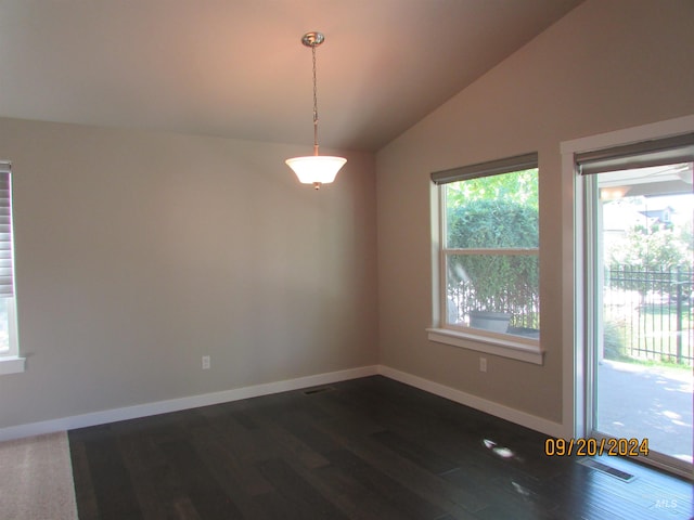 empty room with vaulted ceiling and dark hardwood / wood-style flooring