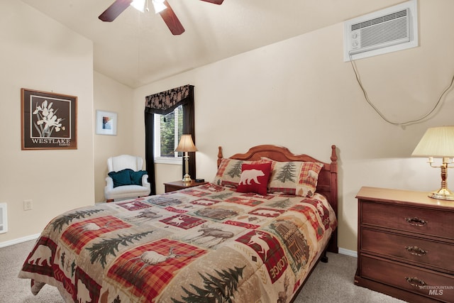 carpeted bedroom with baseboards, vaulted ceiling, a wall mounted air conditioner, and a ceiling fan