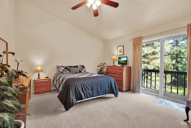 carpeted bedroom featuring access to exterior, vaulted ceiling, and ceiling fan