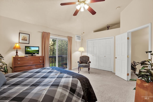 carpeted bedroom with vaulted ceiling, an AC wall unit, access to outside, a ceiling fan, and a closet