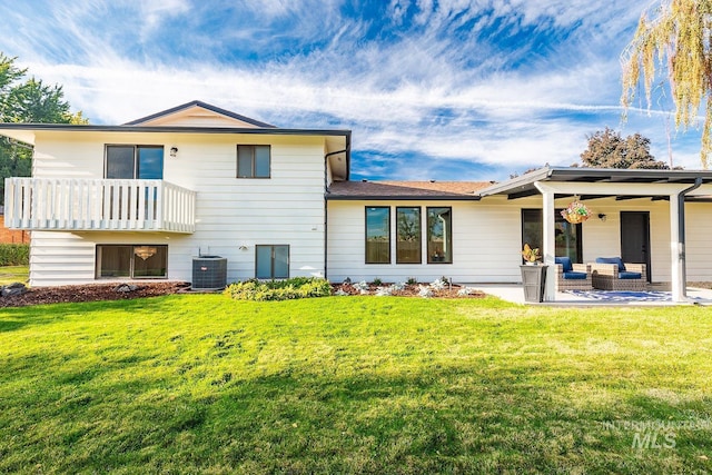 5696 N Kriscliffe, Boise, ID 83704 - back of property featuring central air condition unit, an outdoor hangout area, a yard, and a patio