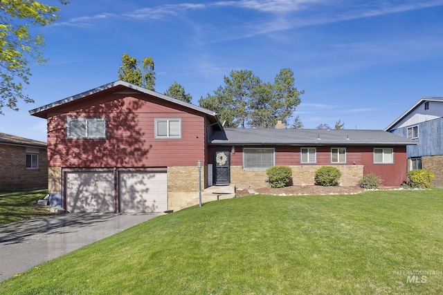 827 Alturas Dr N, Twin Falls, ID 83301 - split level home with concrete driveway, an attached garage, and a front yard