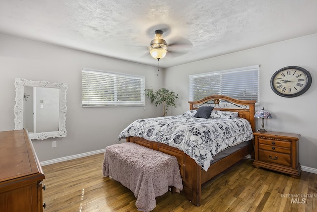 827 Alturas Dr N, Twin Falls, ID 83301 - bedroom with baseboards, a ceiling fan, and wood finished floors