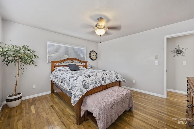 827 Alturas Dr N, Twin Falls, ID 83301 - bedroom with light wood-type flooring, baseboards, and ceiling fan