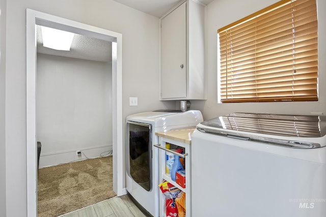 827 Alturas Dr N, Twin Falls, ID 83301 - laundry room with washing machine and dryer, light colored carpet, and cabinet space