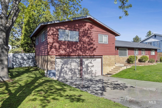 827 Alturas Dr N, Twin Falls, ID 83301 - exterior space featuring an attached garage, a front lawn, and driveway